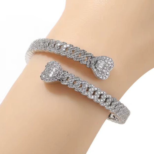 Silver bracelet with diamond-like stones on a mannequin arm against a white background