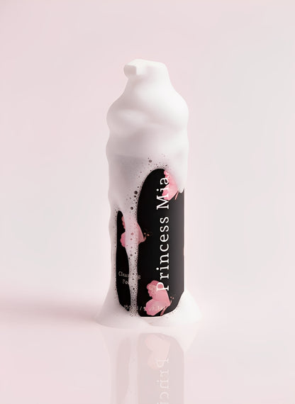 Bottle of Princess Man hair product with foam on a light pink background