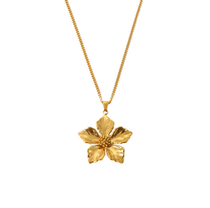 Gold flower pendant necklace on a white background