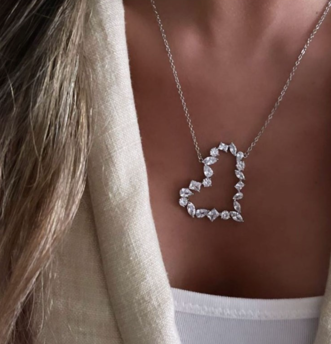 “Elegant open heart pendant necklace with sparkling crystal stones, romantic statement jewelry for women.”