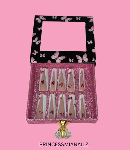 a clock that is on a pink wall 