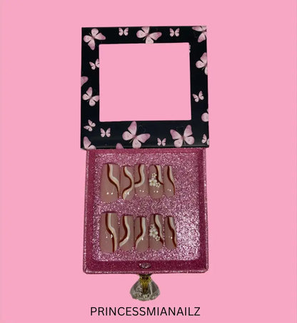 a clock that is on a pink wall 