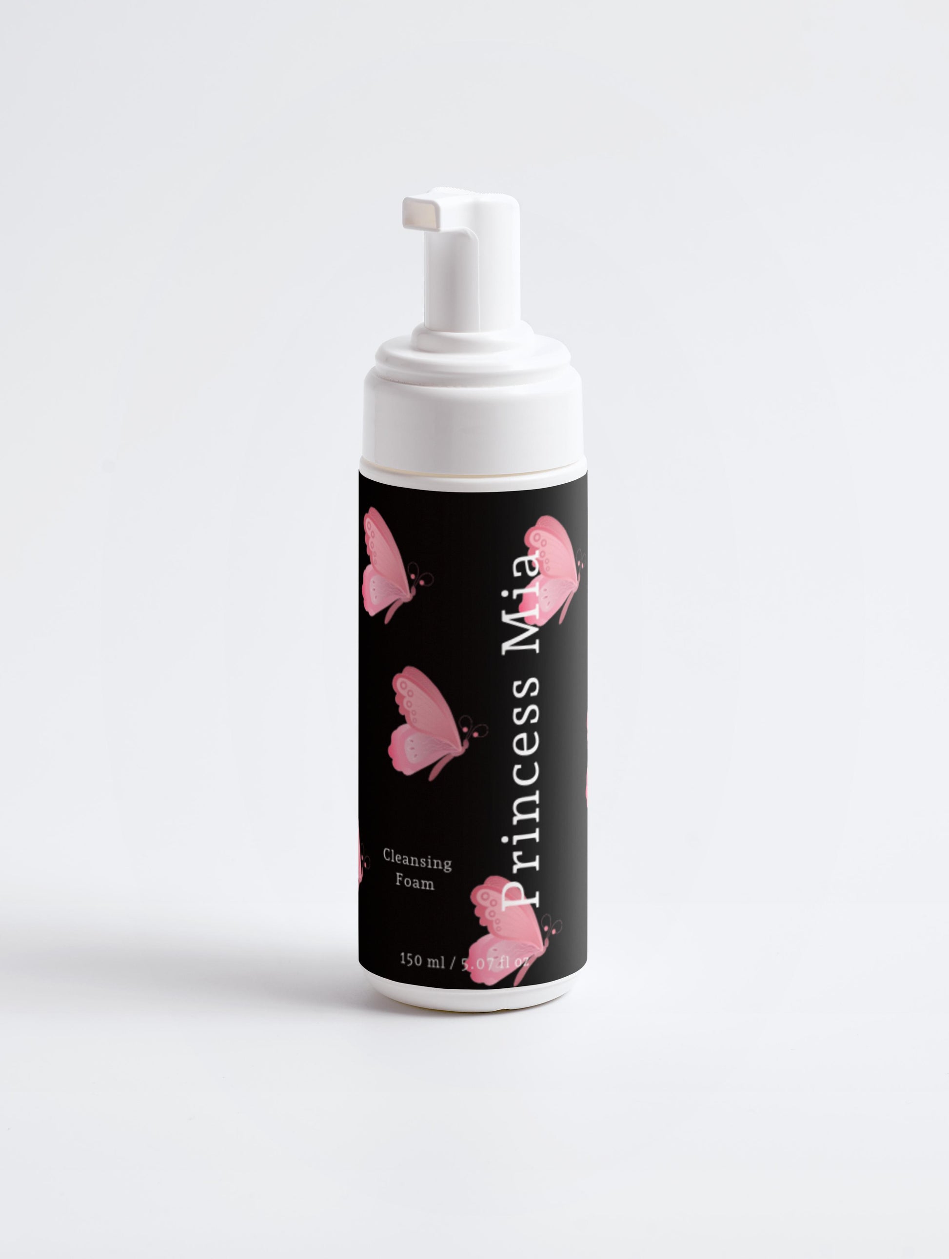 White bottle of Princess Mia Cleansing Foam with pink butterfly design, vegan face cleanser made with rose flower water, chamomile extract, and calendula extract for gentle makeup removal and fresh, glowing skin.